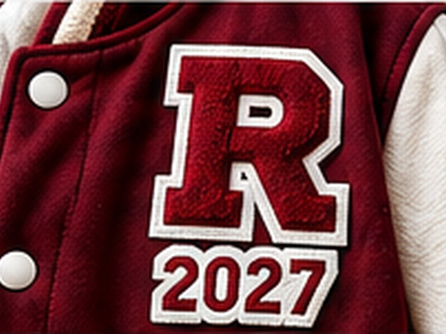 Chenille varsity letter and year patches on a letterman jacket